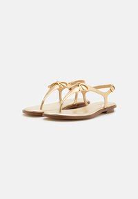 Michael Kors Nori Flat Thong Pale Gold 7.5 M 